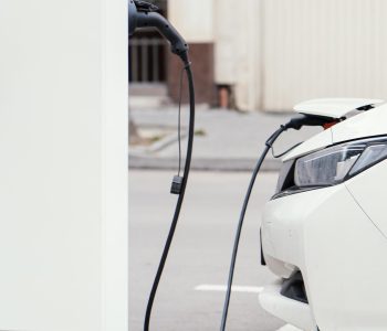 side-view-car-being-charged-electric-vehicle-charging-station